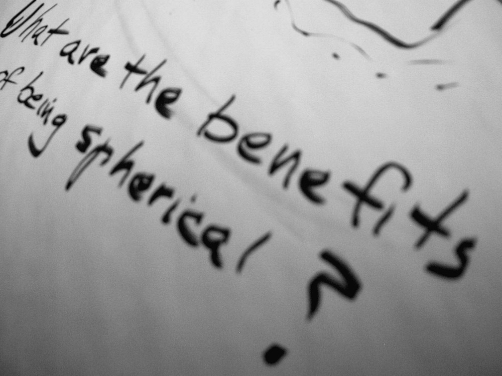Handwritten flip-chart note: What are the benefits of being spherical?