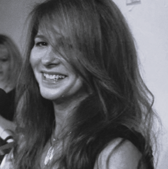 Pamela Lawson laughing at a microphone